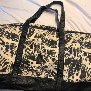 Stylish Black and Cream Women’s Weekend Bag. Black star studs